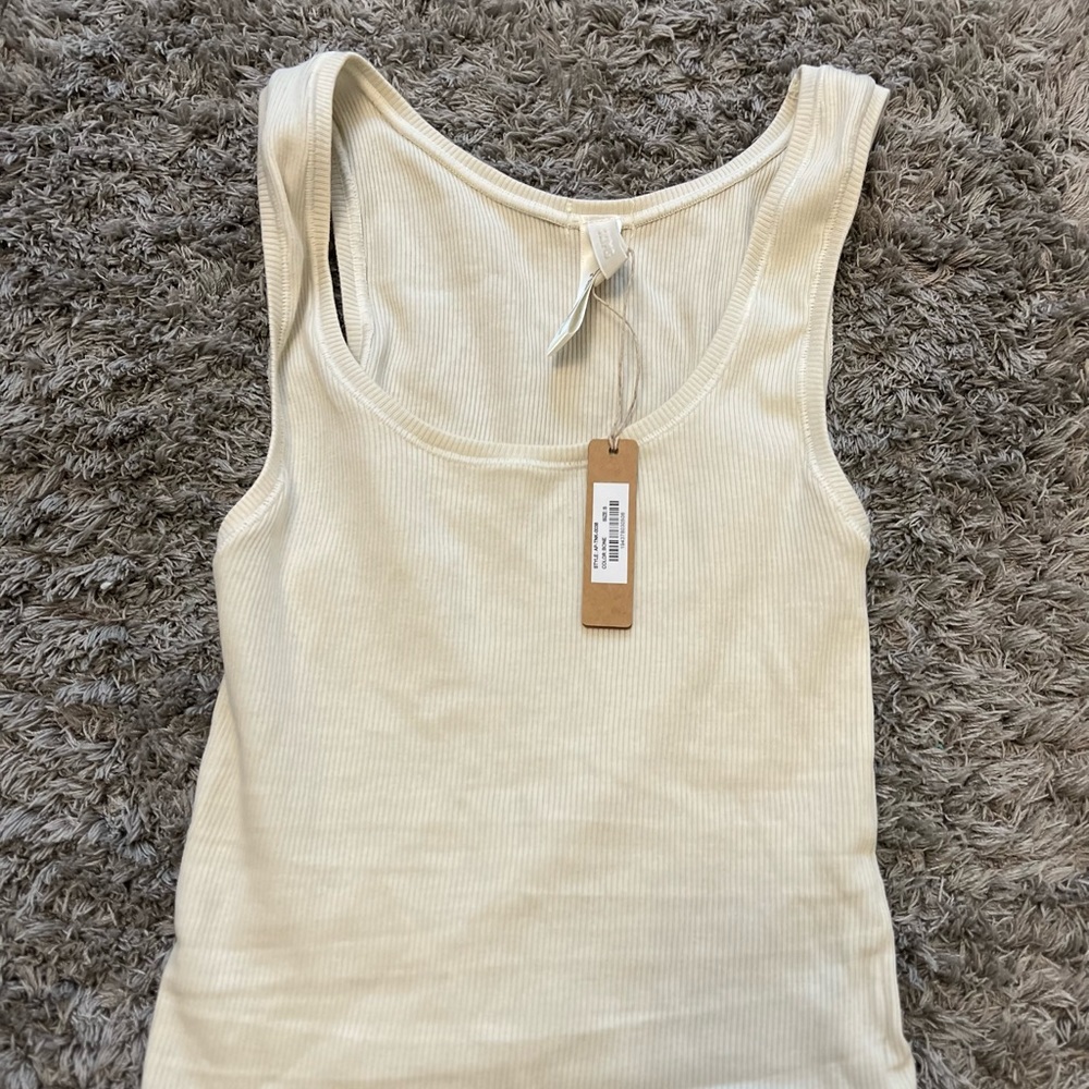 SIZE SMALL. SKIMS COTTON RIB TANK IN “BONE”.